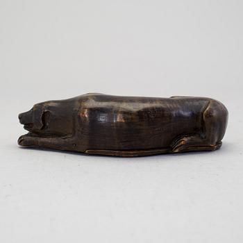 A 19th century snuff box in the shape of a dog.