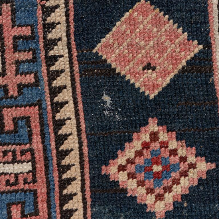 A Caucasian rug, c. 320 x 160 cm.