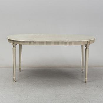 A dining table and six chairs, Gustavian style, second half of the 20th century. One leaf included.