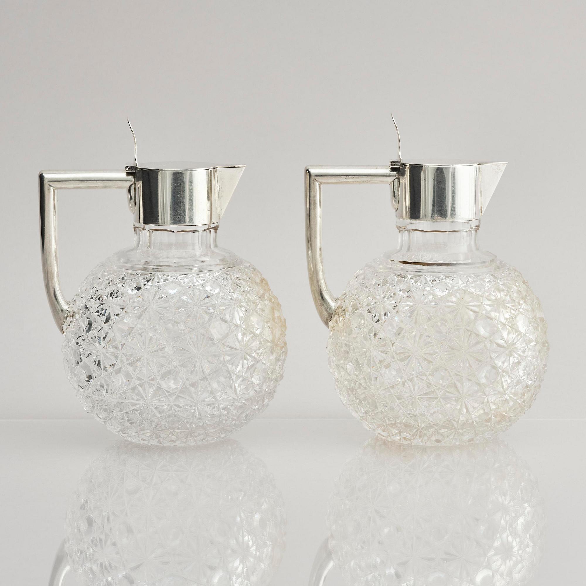 A Swedish pair of silver and cut-glass decanters, mark of C.G. Hallberg, Stockholm 1893.