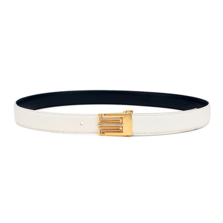 CHRISTIAN DIOR, a reversible blue and white belt with exchangeable belt buckle.