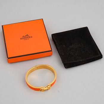 HERMÈS, a 'Clic H' bangle.