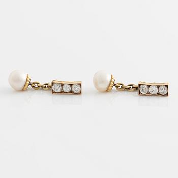 A pair of jewelled, pearl and gold Imperial presentation cufflinks by Constantine Nicholls Ewing, St Petersburg ,