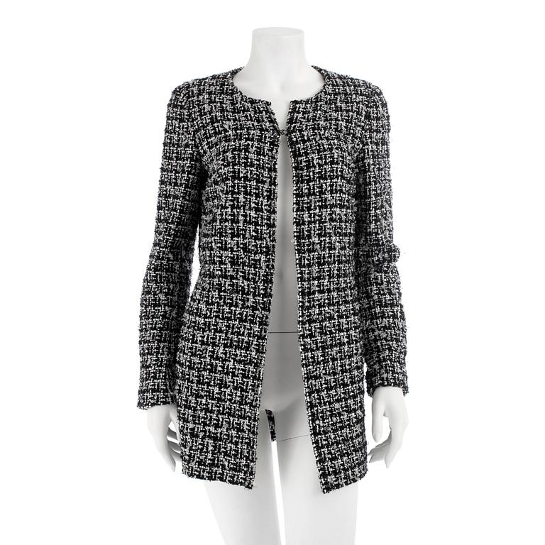 CHANEL, ablack and white bouclé jacket, spring 2009.Size 40.