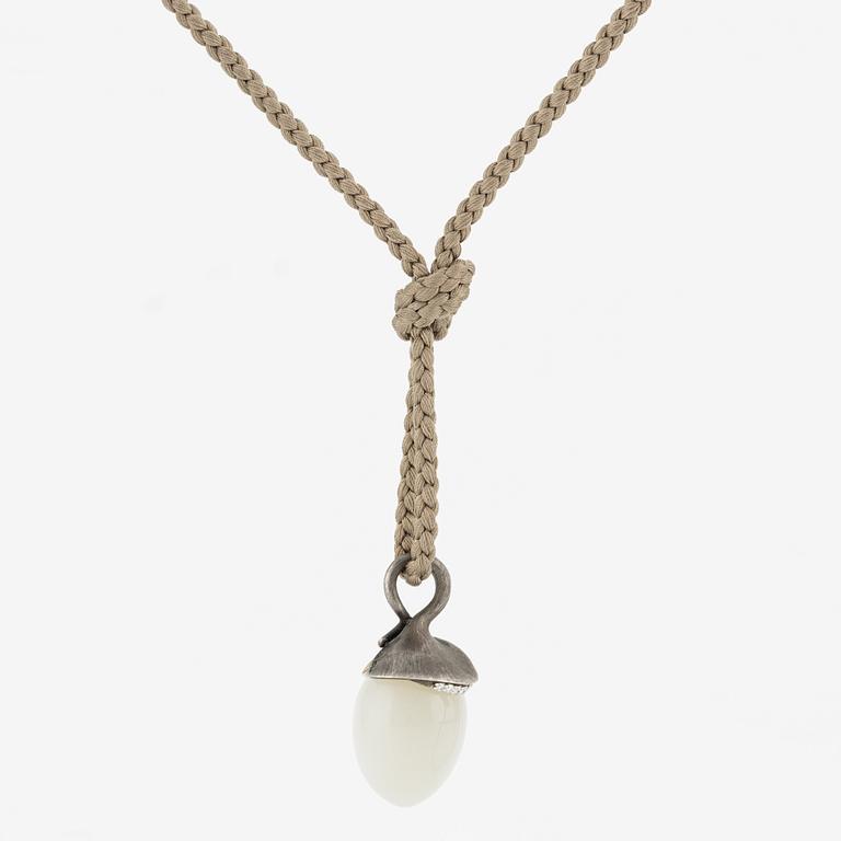 Ole Lynggaard, pendant, "Lotus", gold and silver with small brilliant-cut diamonds and likely moonstone.