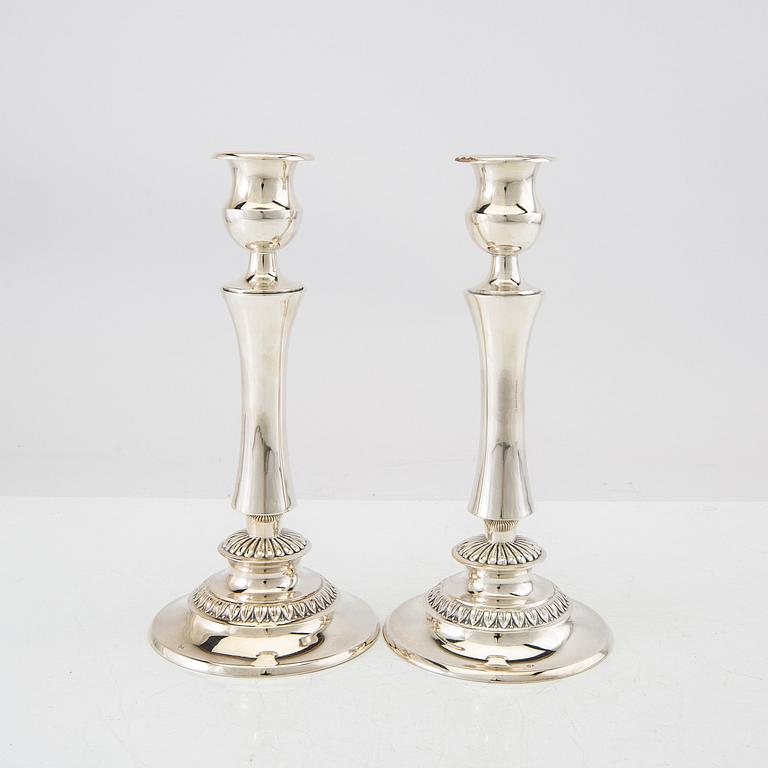 A pair of silver candlesticks with Swedish import stamps.