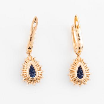 Pear shaped sapphire and brilliant cut diamond earrings.