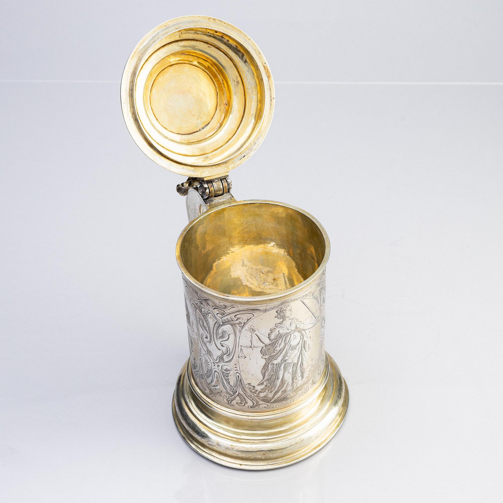 A German parcel-gilt silver tankard, mark of Walter Kopman, Hamburg (1649-1688).