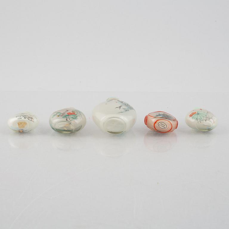 A group of nine Chinese glass and porcelain snuffbottles, 20th century.