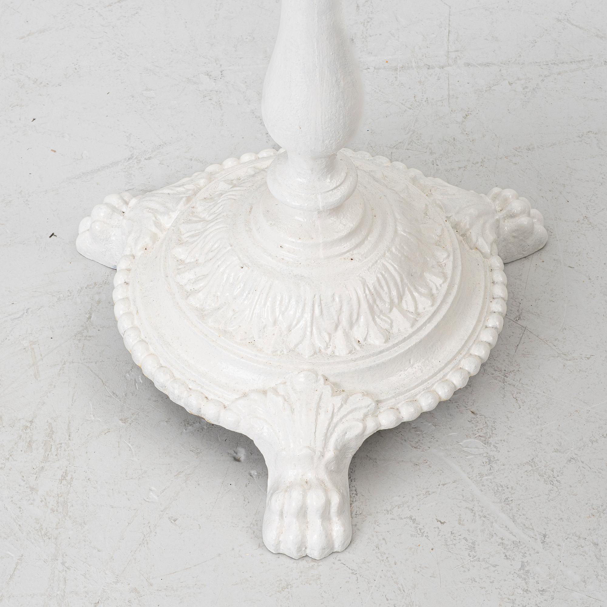 A pair of café tables, around 1900.