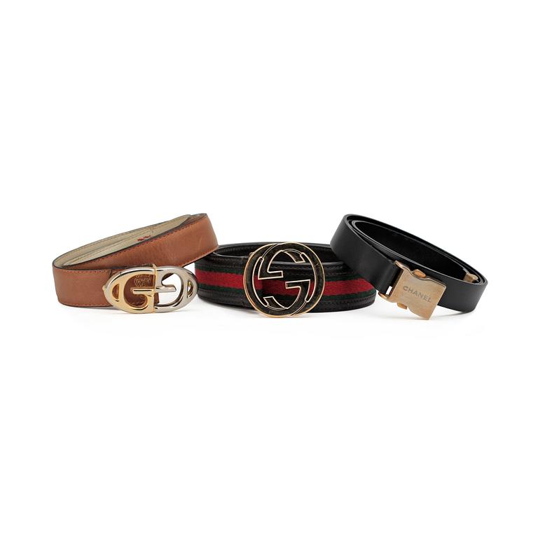 GUCCI and CHANEL, three leather belts.