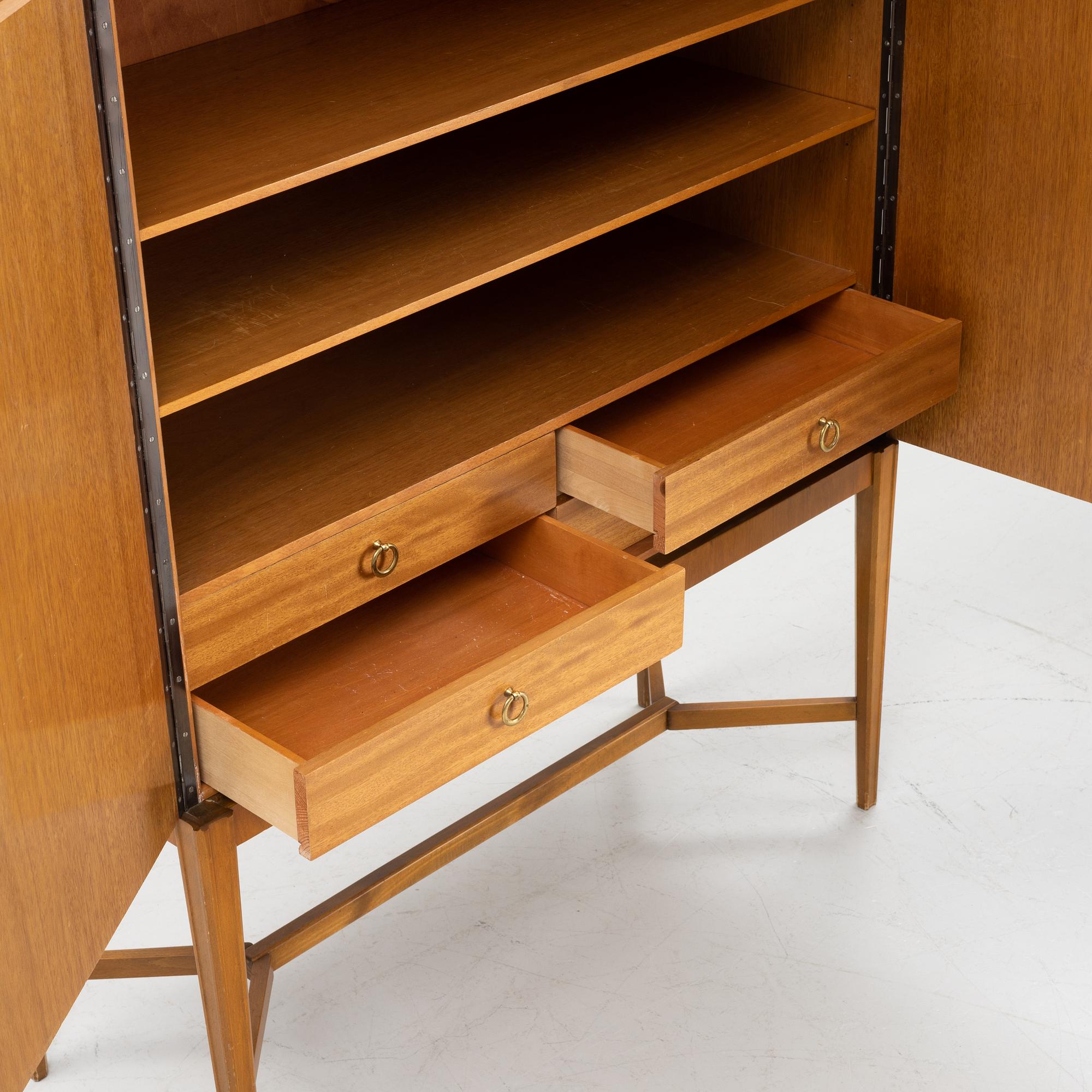 Erik Matsson, a walnut-veneered cabinet, Mjölby Intarsia, 1940's/50's.