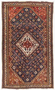 An antique Kashghai rug, c. 240 x 40 cm.