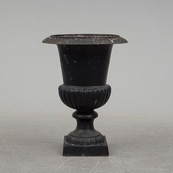 a 20th century cast iron garden urn.