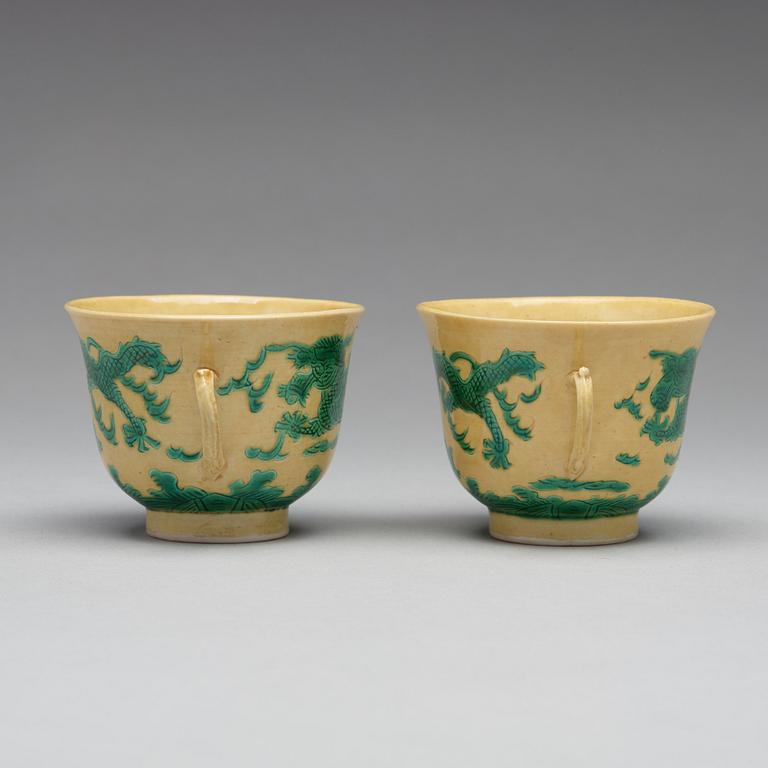 A pair of yellow glazed tea cups with stands, Qing dynasty with Guangxus six character mark (1875-1908).