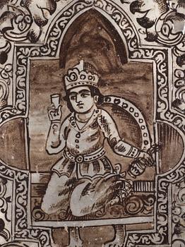 A Qajar moulded figural pottery tile, ca 45 x 35 cm.