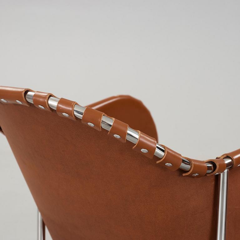 Mats Theselius, A pair of 'Bruno' brown leather and steel easy chairs, Källemo, Sweden.