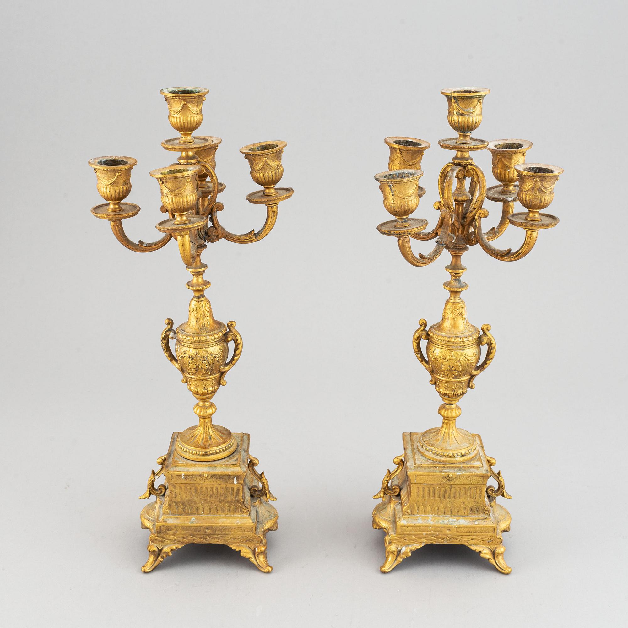 A late 19th century table clock and candelabra, probably France.