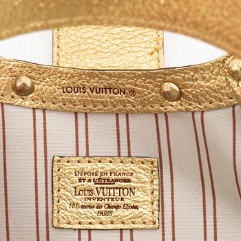 Louis Vuitton, a white canvas and gold 'Theda PM' bag, 2004.