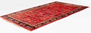 An East Turkestan silk carpet, ca 308 x 182 cm.
