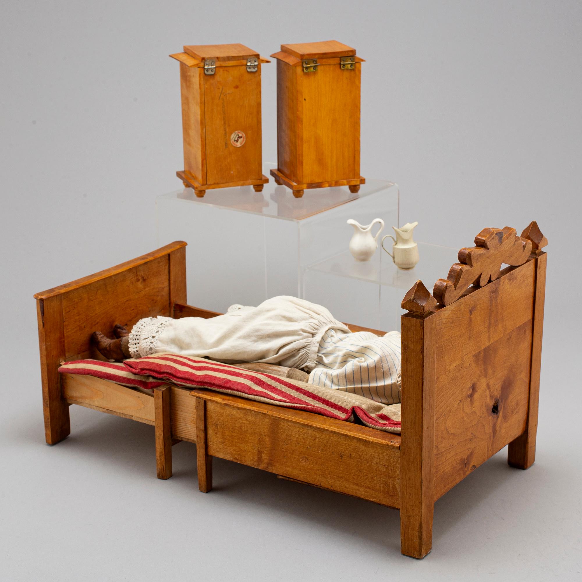 A china head doll and a 3 psc of doll furniture.