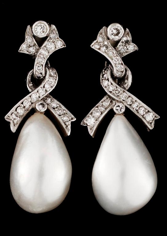 A pair of gold and natural pearl earrings.
