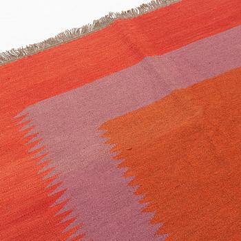 A persian kilim rug, approximately 243 x 179 cm.