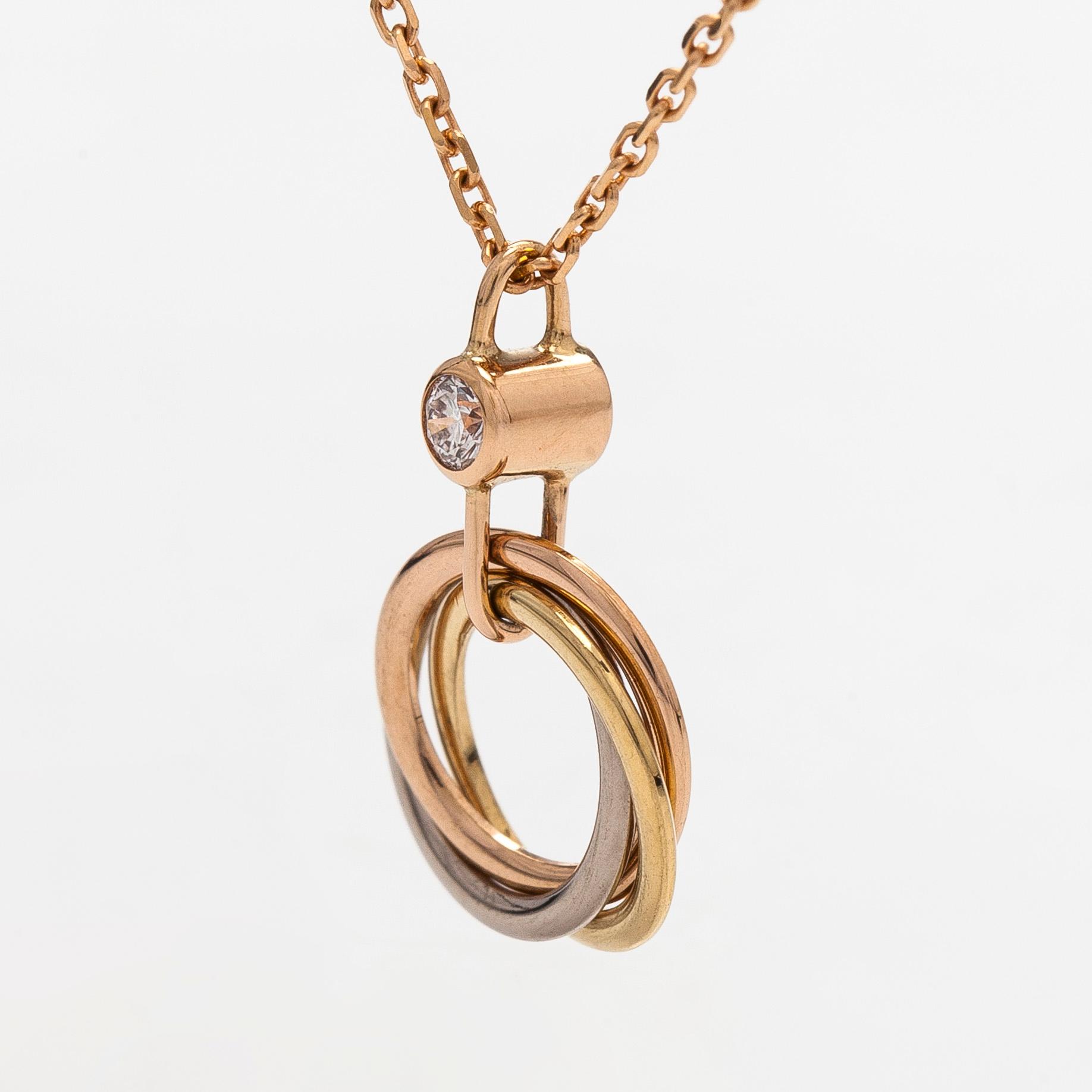 Cartier, halsband, "Trinity Pendant", 18K guld och en briljantslipad diamant.
