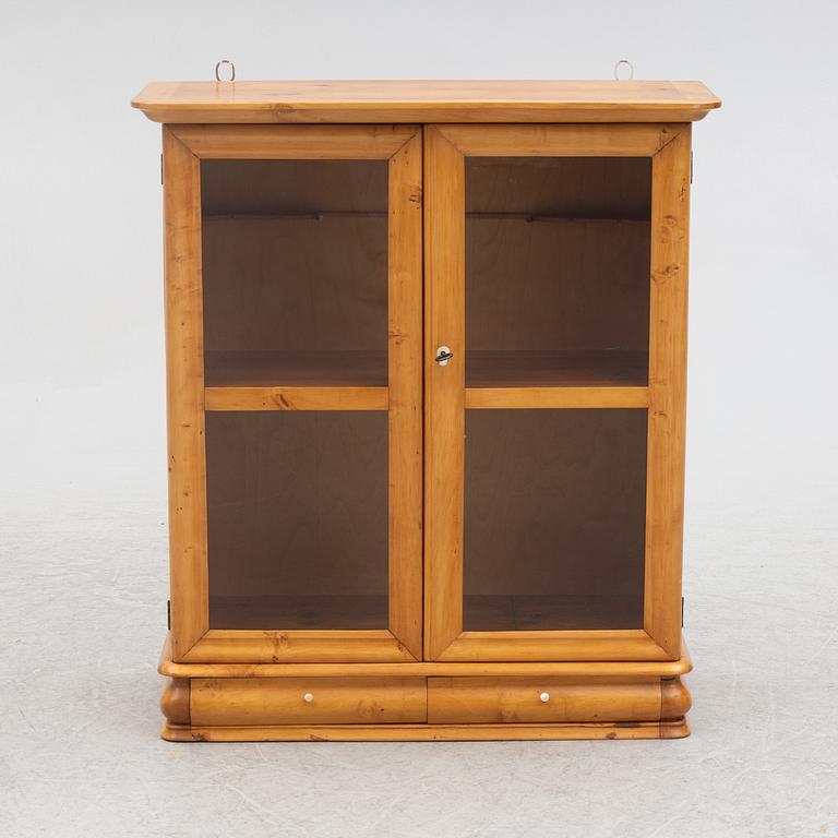 A small wall cabinet, around 1900.