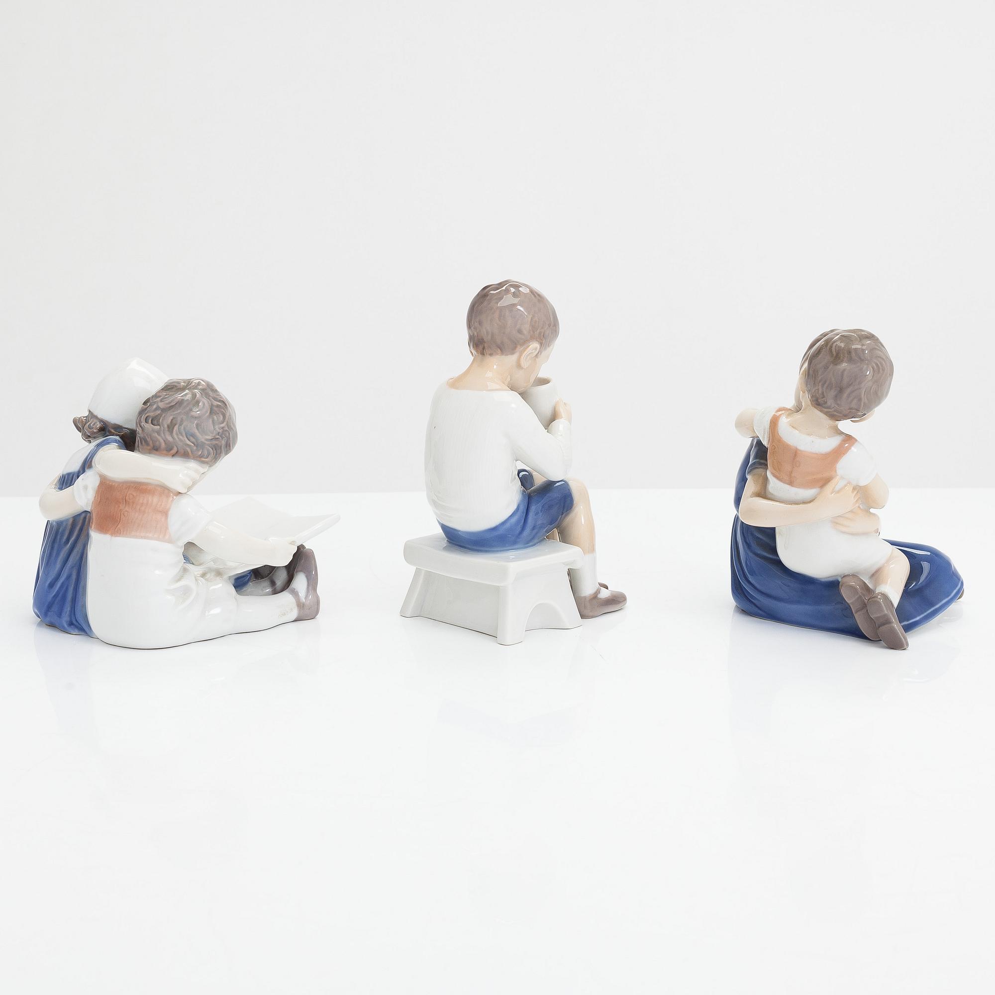 Four Bing & Grondahl figurines and a Royal Copenhagen vase, mid 20th century.