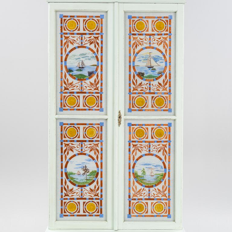 A painted cabinet, circa 1900.