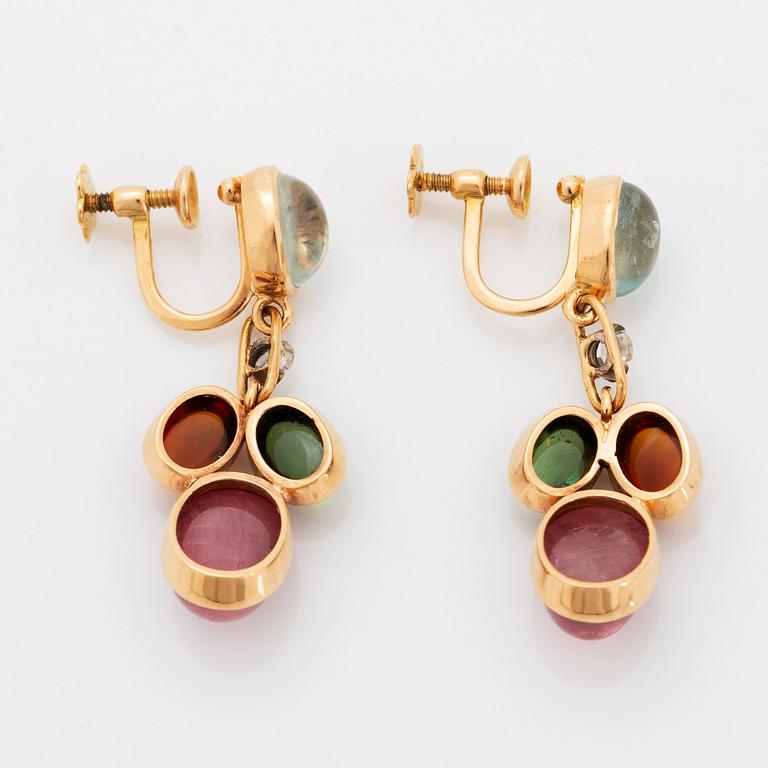 A pair of WA Bolin earrings.