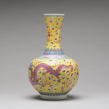 A yellow glazed dragon and phoenix vase, China, circa 1900.