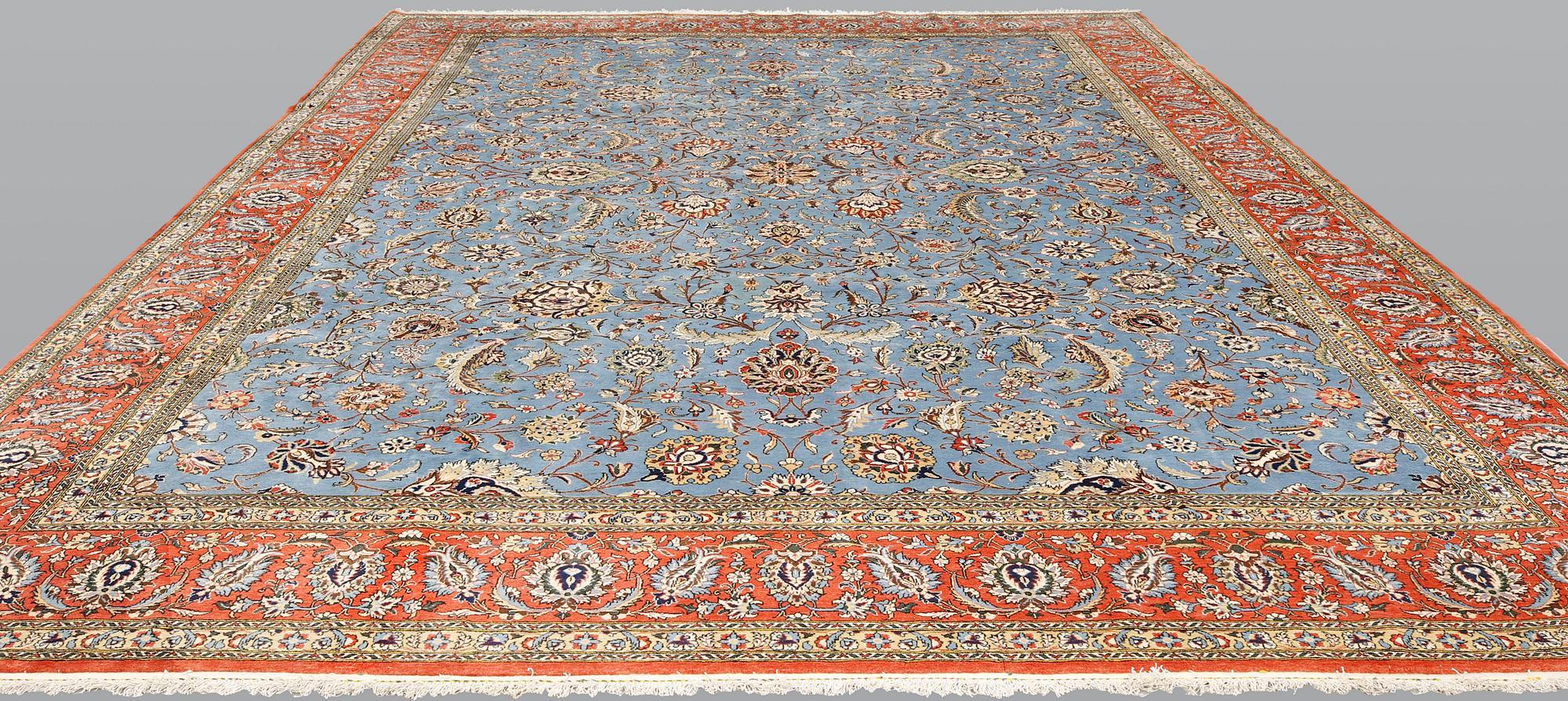 A Ghom carpet, part silk, approx. 480 x 350 cm.