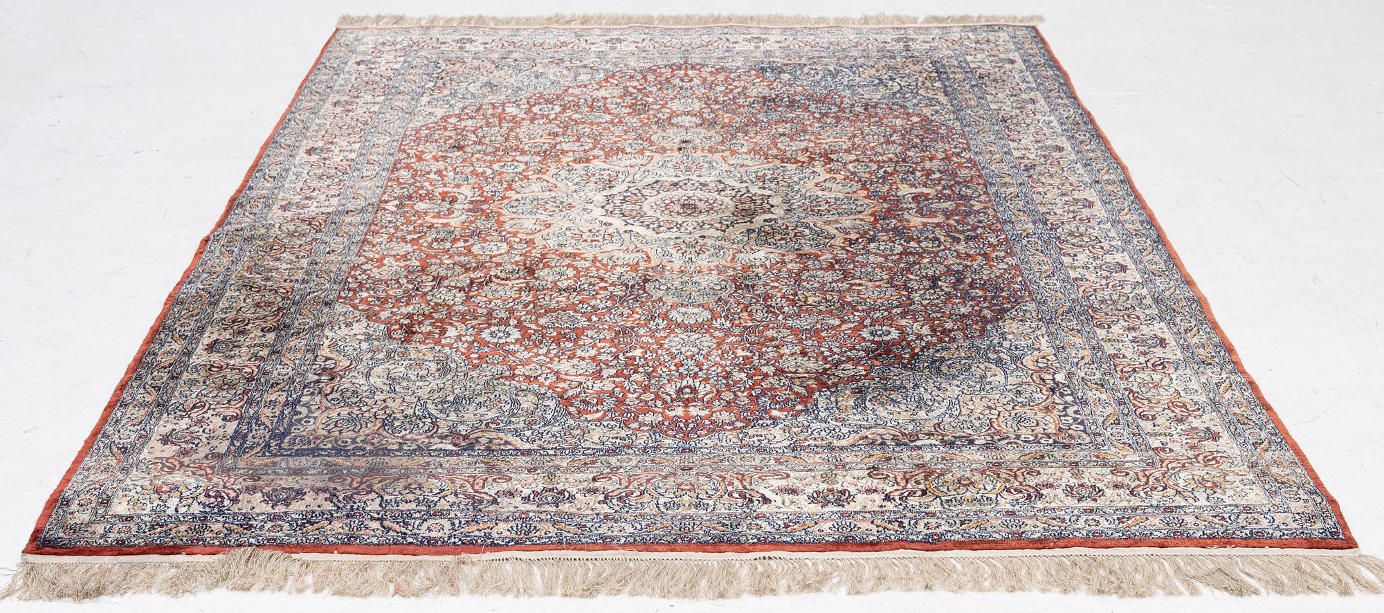 Carpet, part silk, approx. 240 x 158 cm.