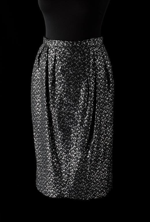An ensemble consisting of skirt, top, belt and scarf by Christian Dior.