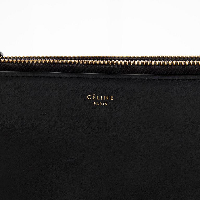 Céline, a black leather 'Trio' bag.