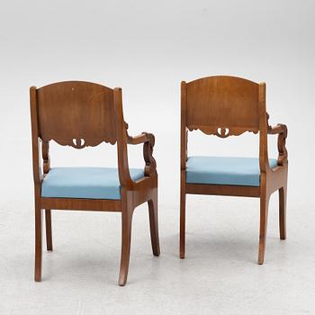 A pair of Baltic late Empire mahogany open armchairs, ca 1840.