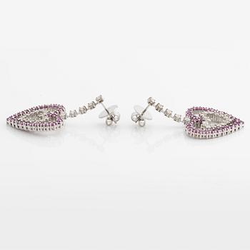 A pair of 18K gold earrings with round brilliant-cut diamonds and pink sapphires.