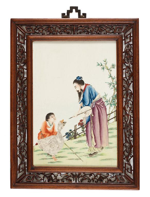 A plaque with enameled decor of man and boy with geese, Qing Dynasty, early 20th Century.