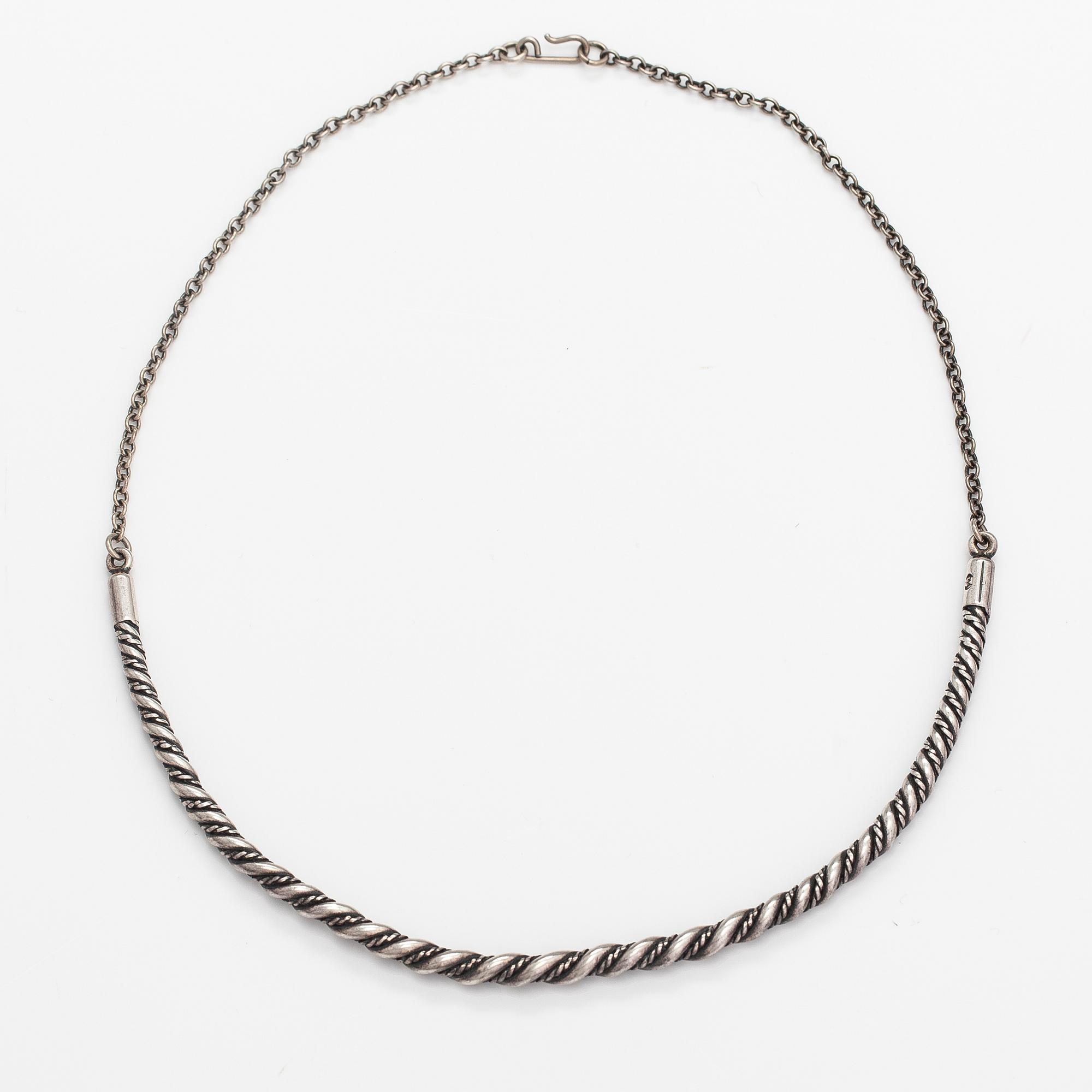 A sterling silver necklace "Twined jewellery from Lampola in Halikko". Kalevala koru, Helsinki 1992.