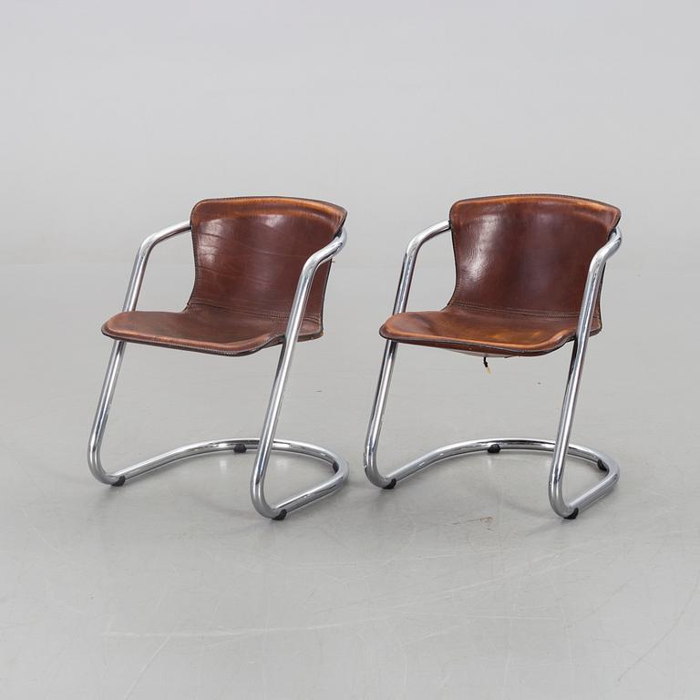 A pair of Willy Rizzo chairs.