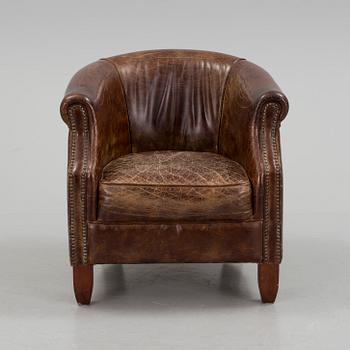A leather club lounge chair by Newport, ca 2000.
