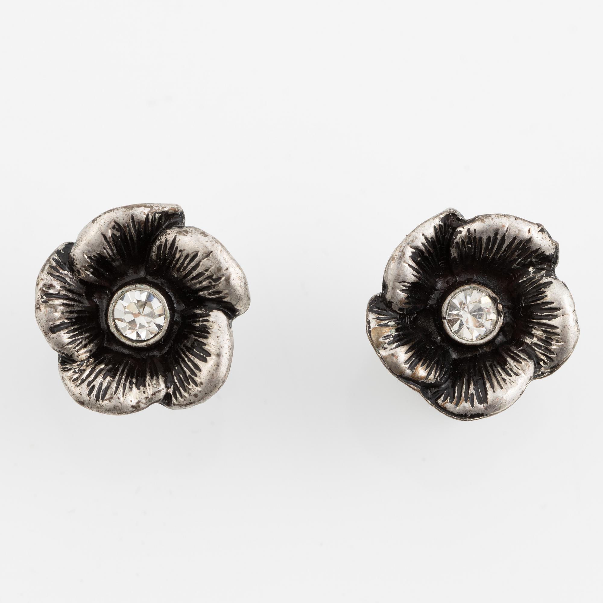 Necklace with matching earrings, white metal in floral design with glass stones.