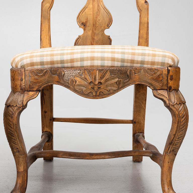 An assembled suite of ten rococo chairs, Western Sweden, later part 18th century.