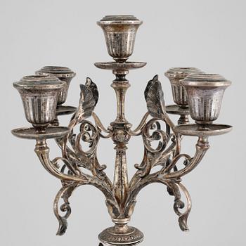 A pair of silver candelabras by Gustaf Möllenborg 1823-1850 (1930), Stockholm, 1875.