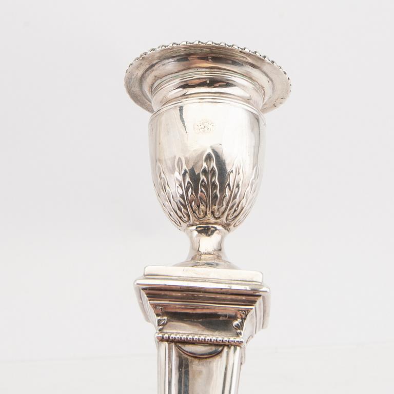 An English 20th century pair of silver candle sticks mark of Mappin & Webb London around 1900.