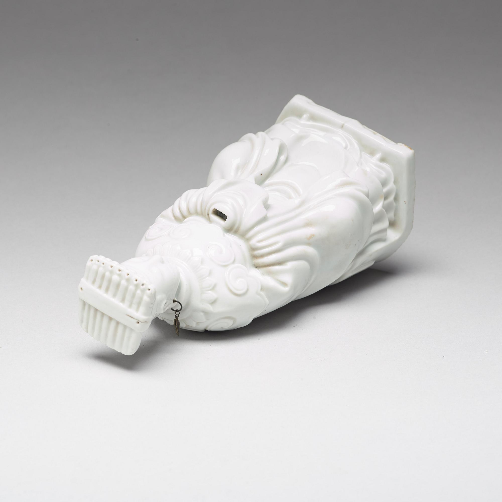 A blanc de chine figure of a deity, Qing dynasty, 19th Century.