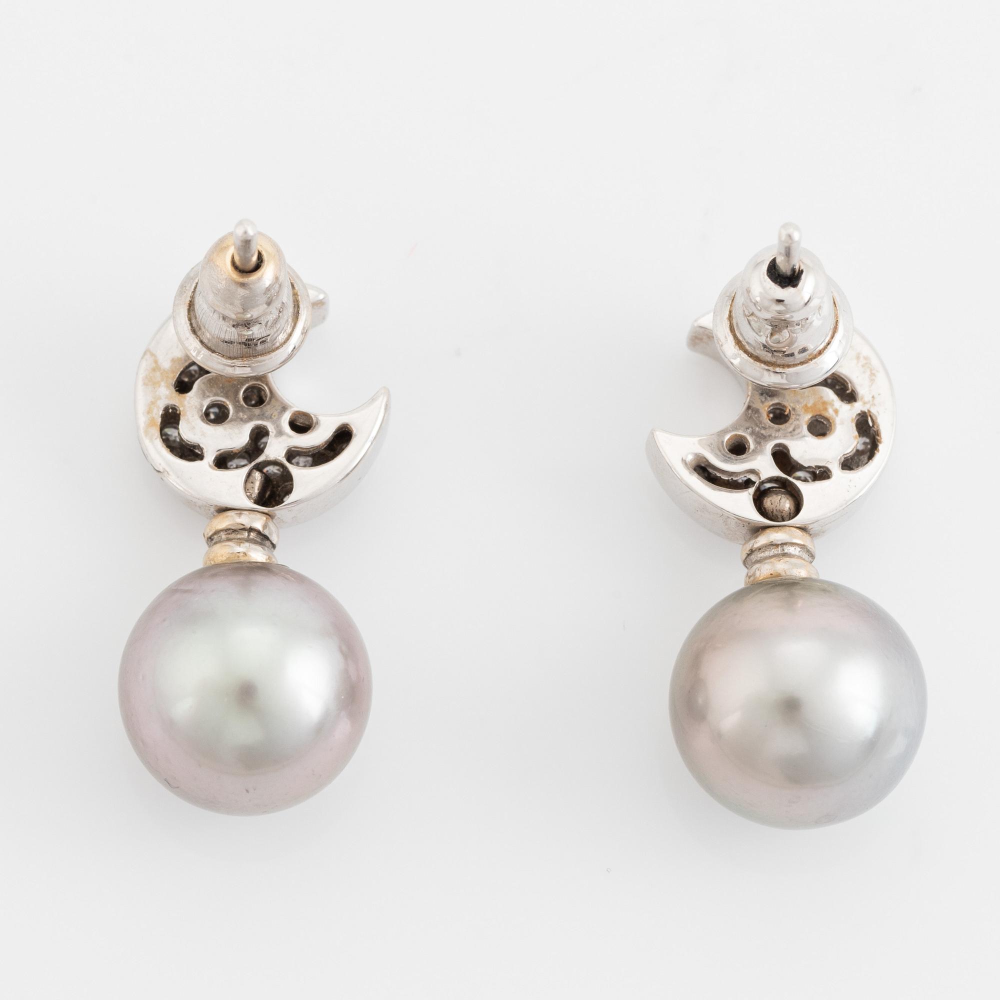 Brilliant cut diamond moon shape and cultured grey pearl earrings.