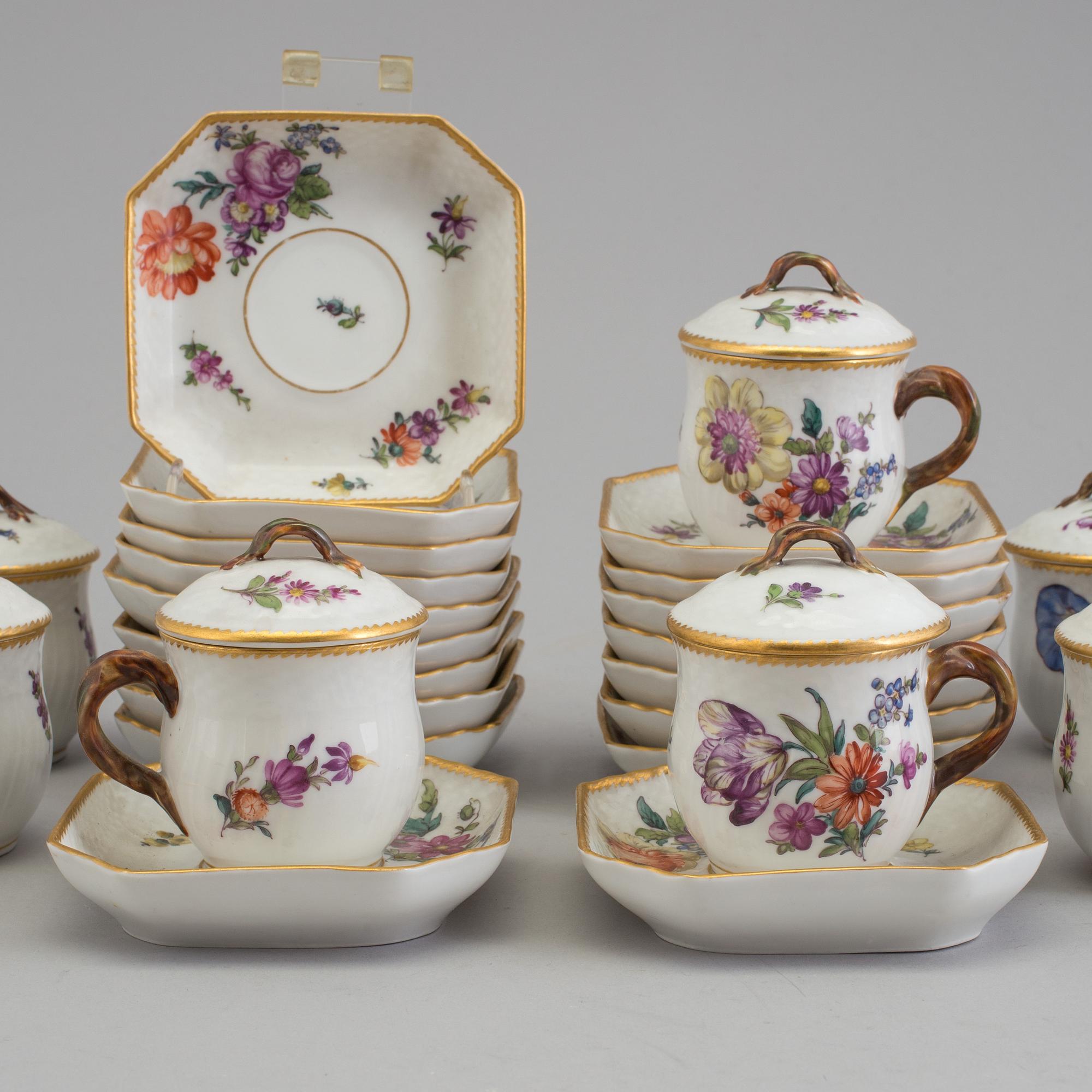 A set of 18 Royal Copenhagen Saxon Flower 1542 Custard Cups with Lids and Saucers.